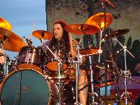 Behind the cymbals
