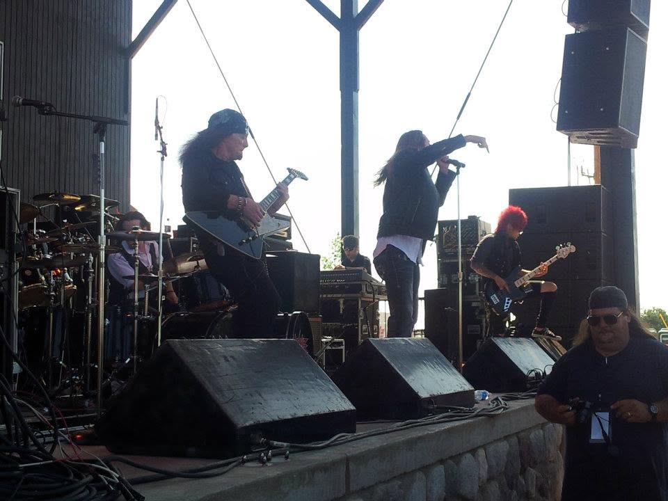 At the side of the stage