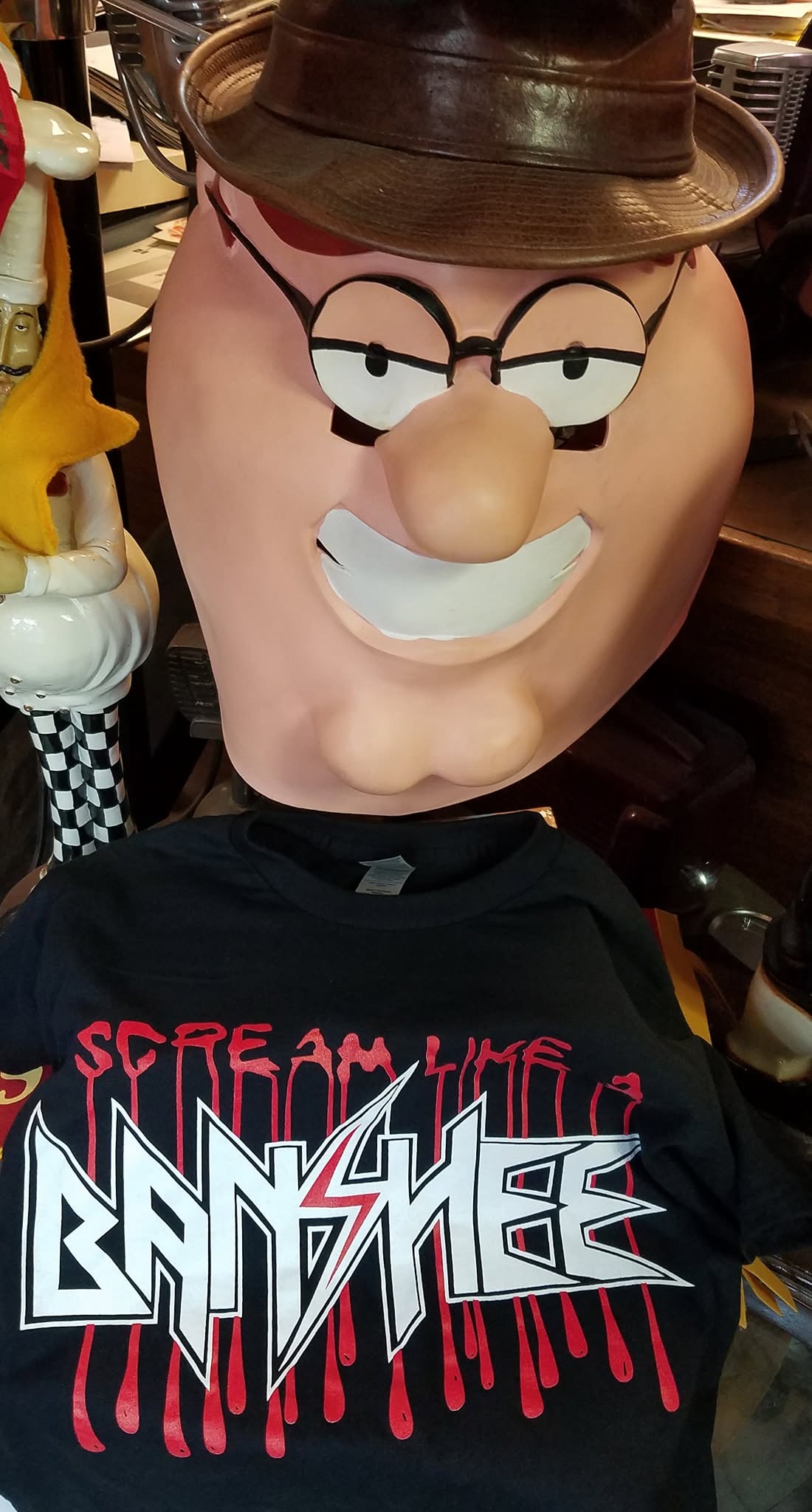 A display figure in a Banshee shirt