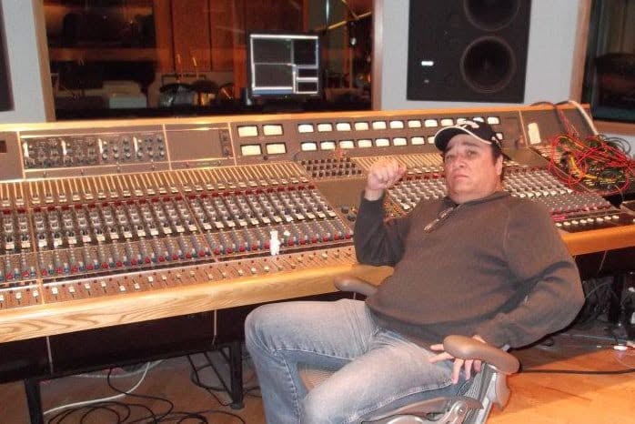 At the studio desk
