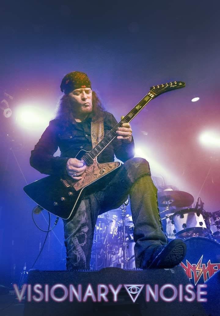 Under blue stage lights